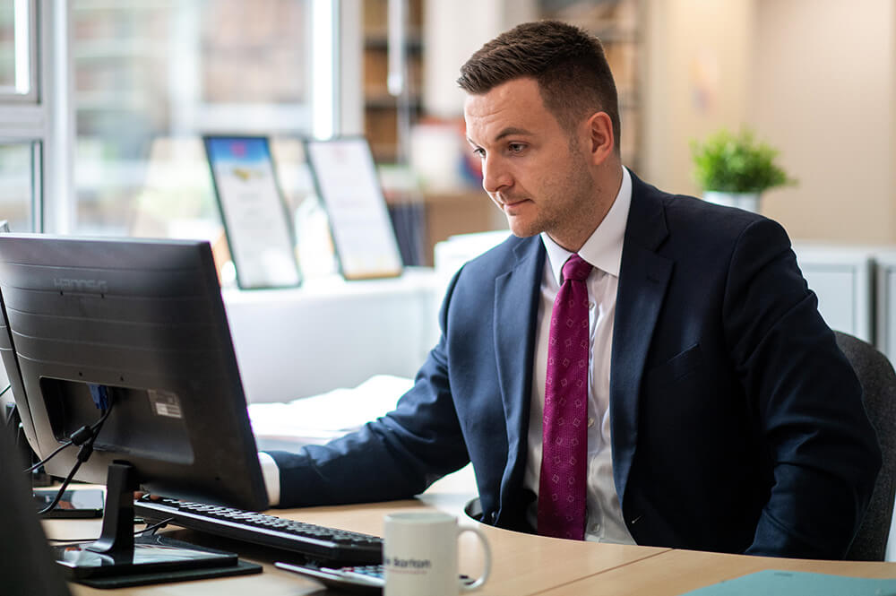 man on desktop computer