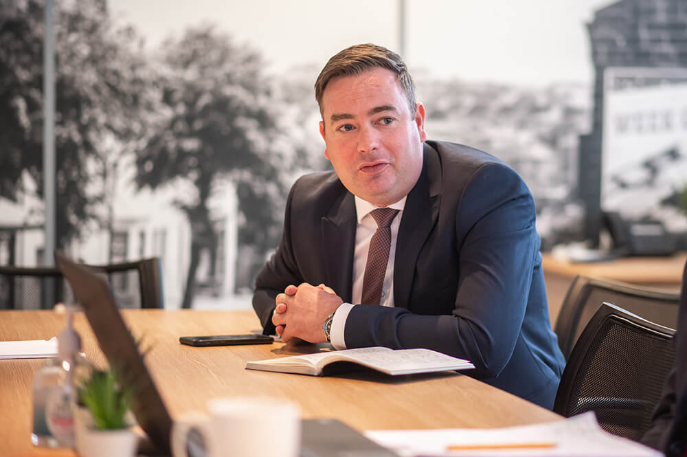 man at boardroom table