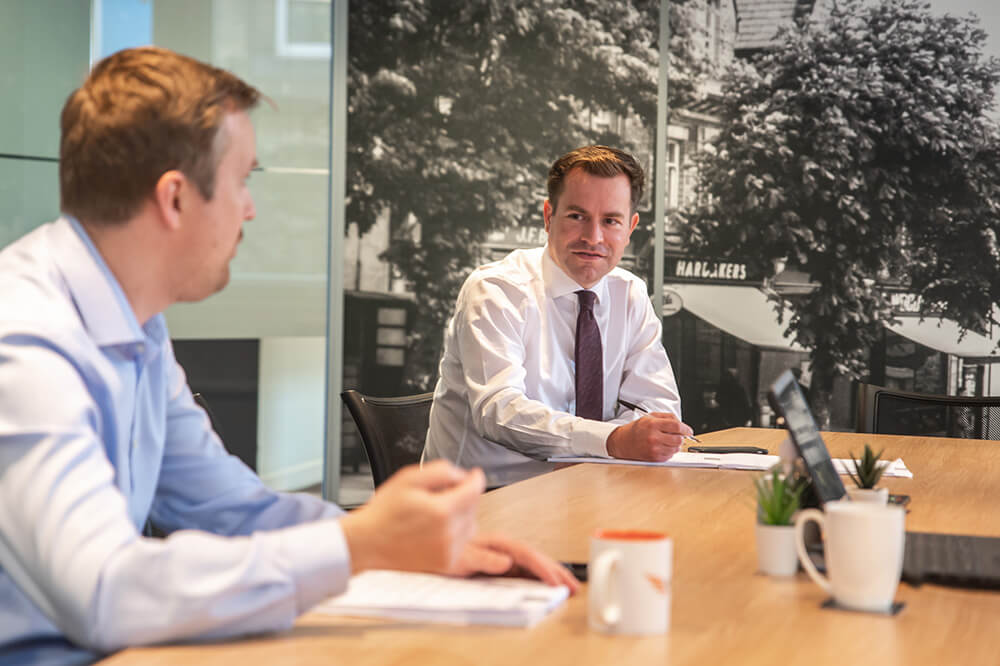 two men in boardroom