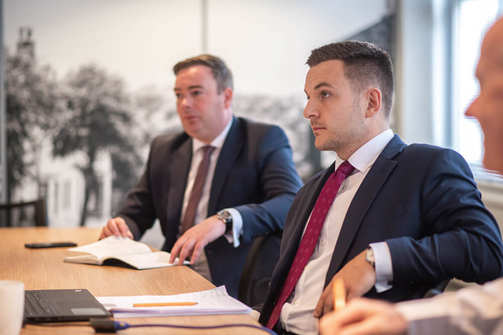 two men in boardroom